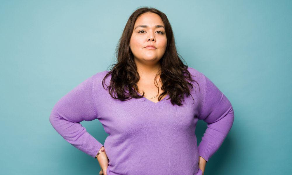 proud woman with hands on hips